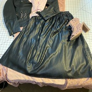 Black faux leather laser cut skirt.